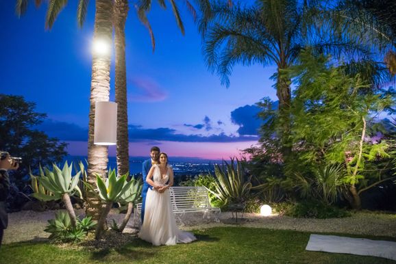 Wedding couple at sundown in the garden of Casa delle Terre Forti in Sicily