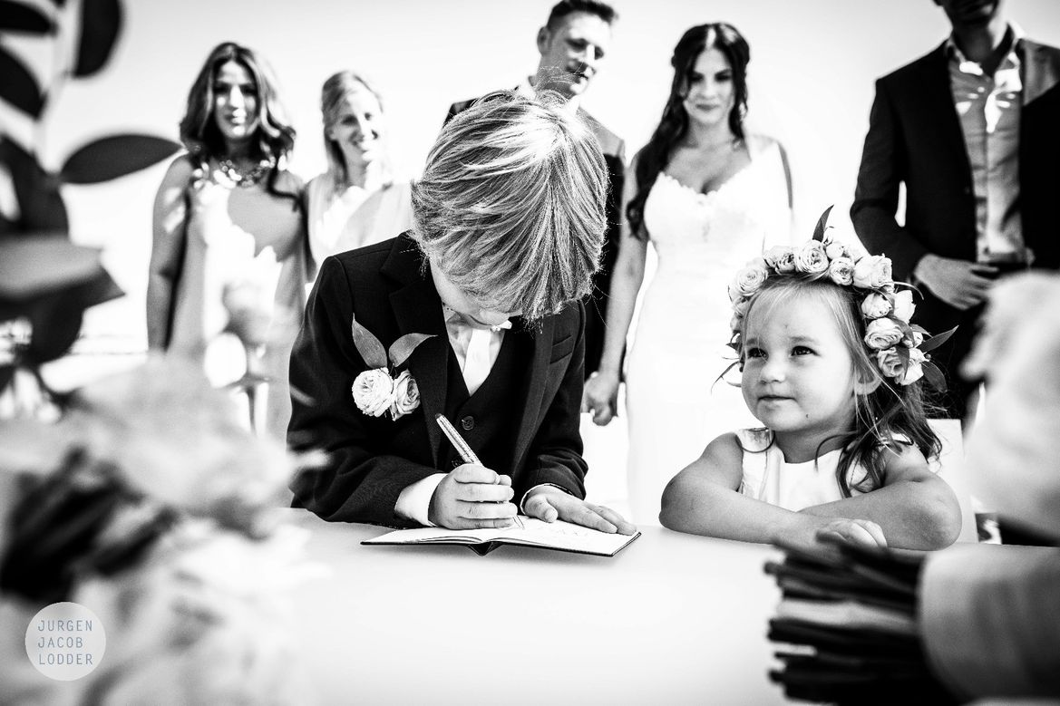 children of the wedding couple signing at the ceremony