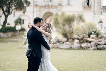 Bride and Groom in front of a wedding venue in Sicily